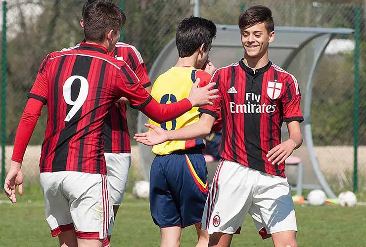 happy young football player of ac milan
